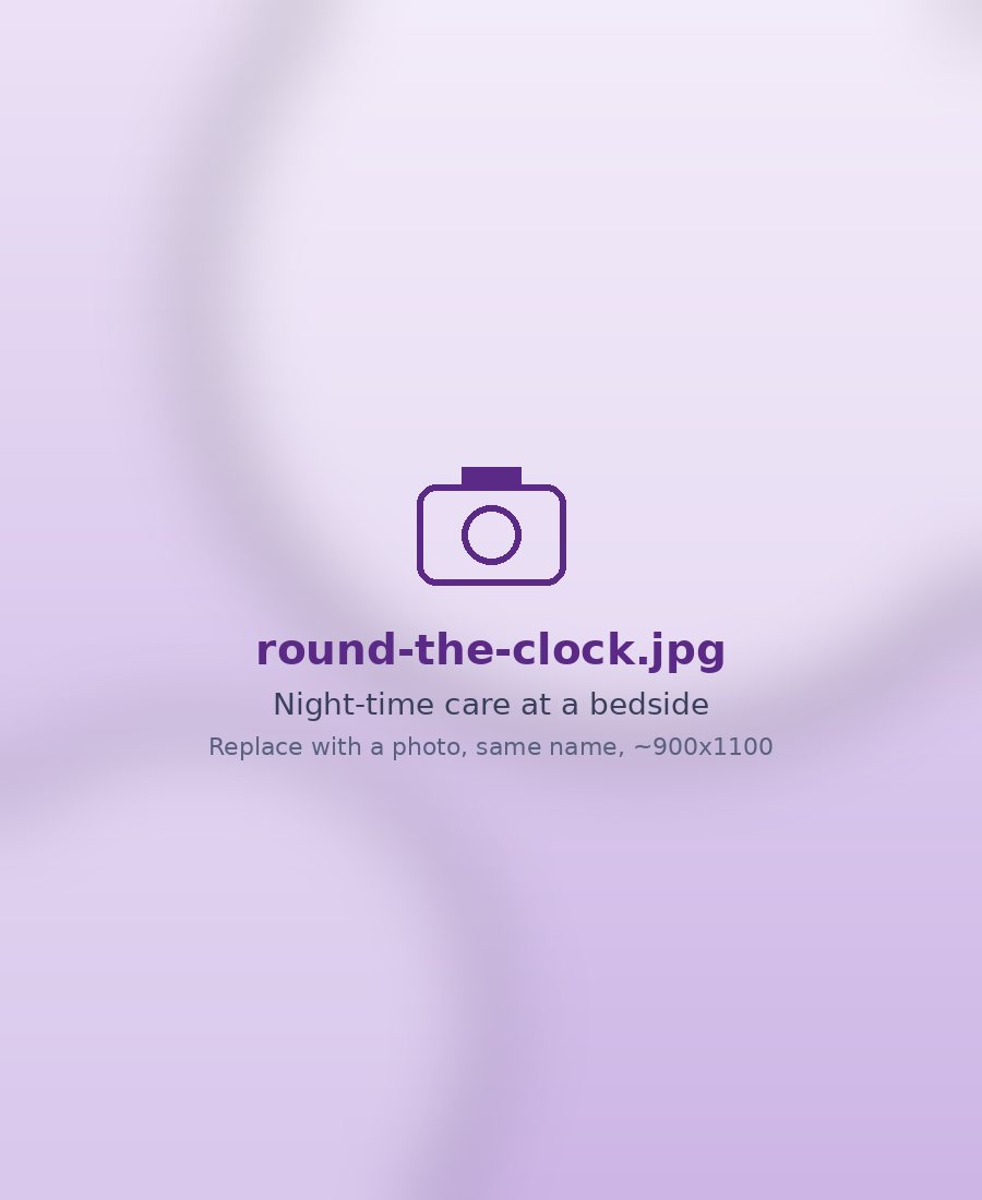 Caregiver at a patient's bedside at night